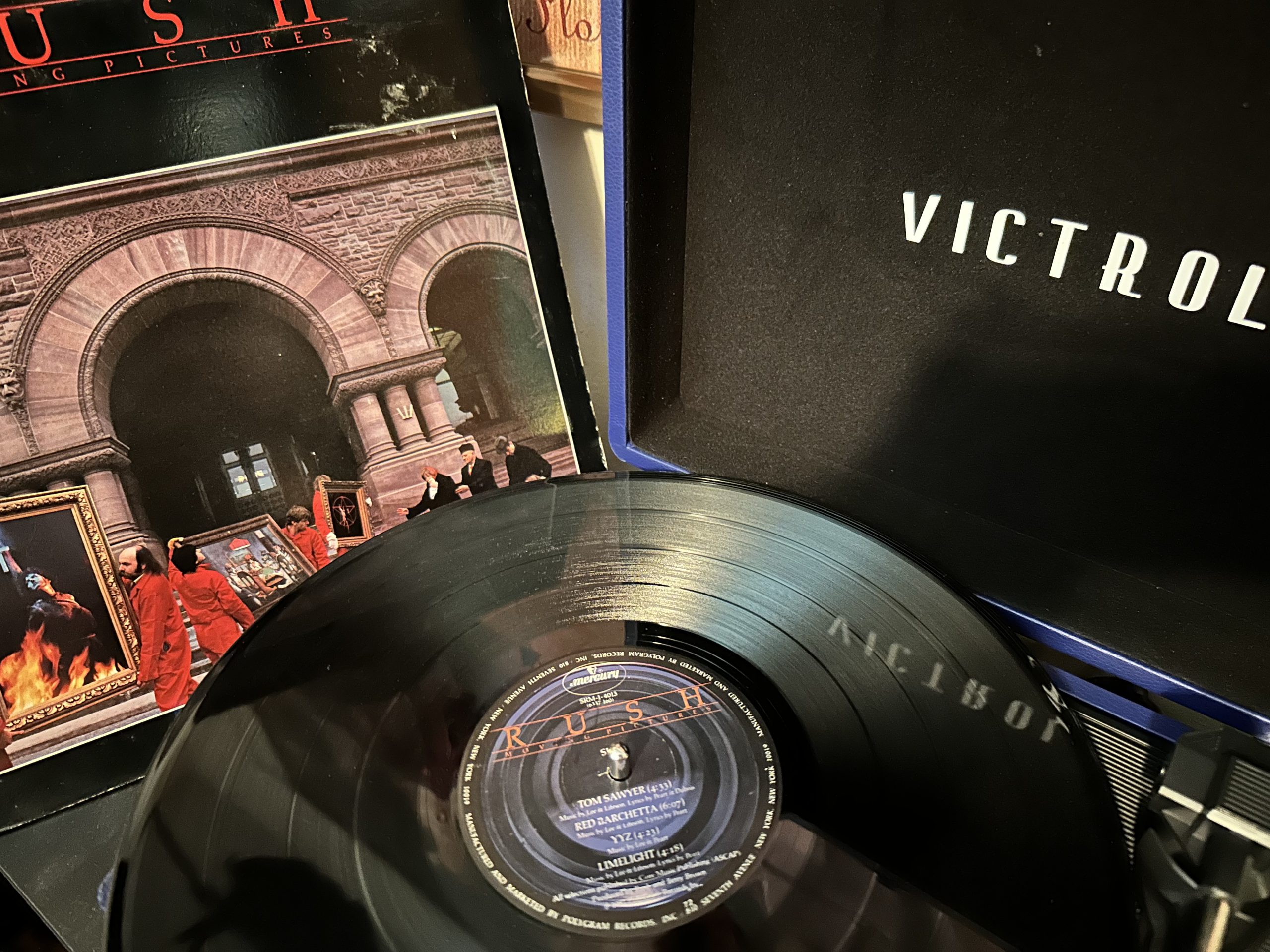 Rush's Moving Pictures vinyl album on a turntable.